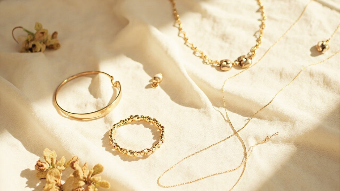 minimalist flat lay of stylish accessories on soft linen in warm natural light