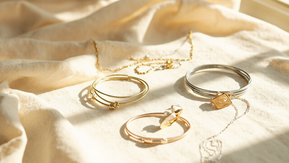 minimalist jewelry displayed on linen with soft daylight and warm metallic accents