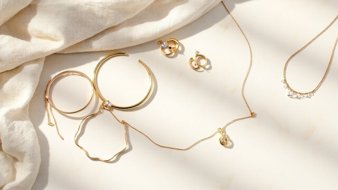 minimalist jewelry flat lay with bracelets earrings and necklaces in soft daylight